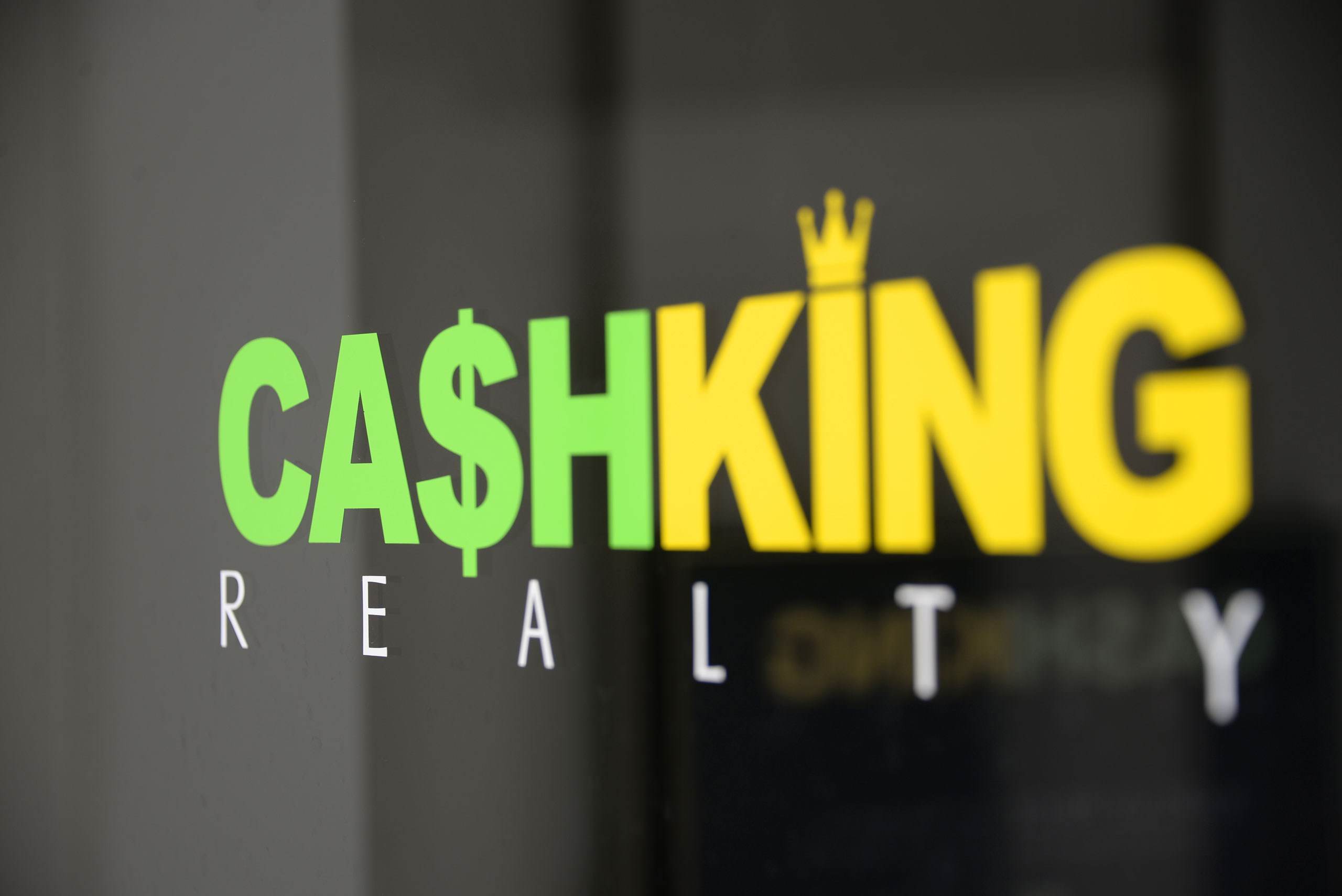 The Cash King Realty sign on the company's office building